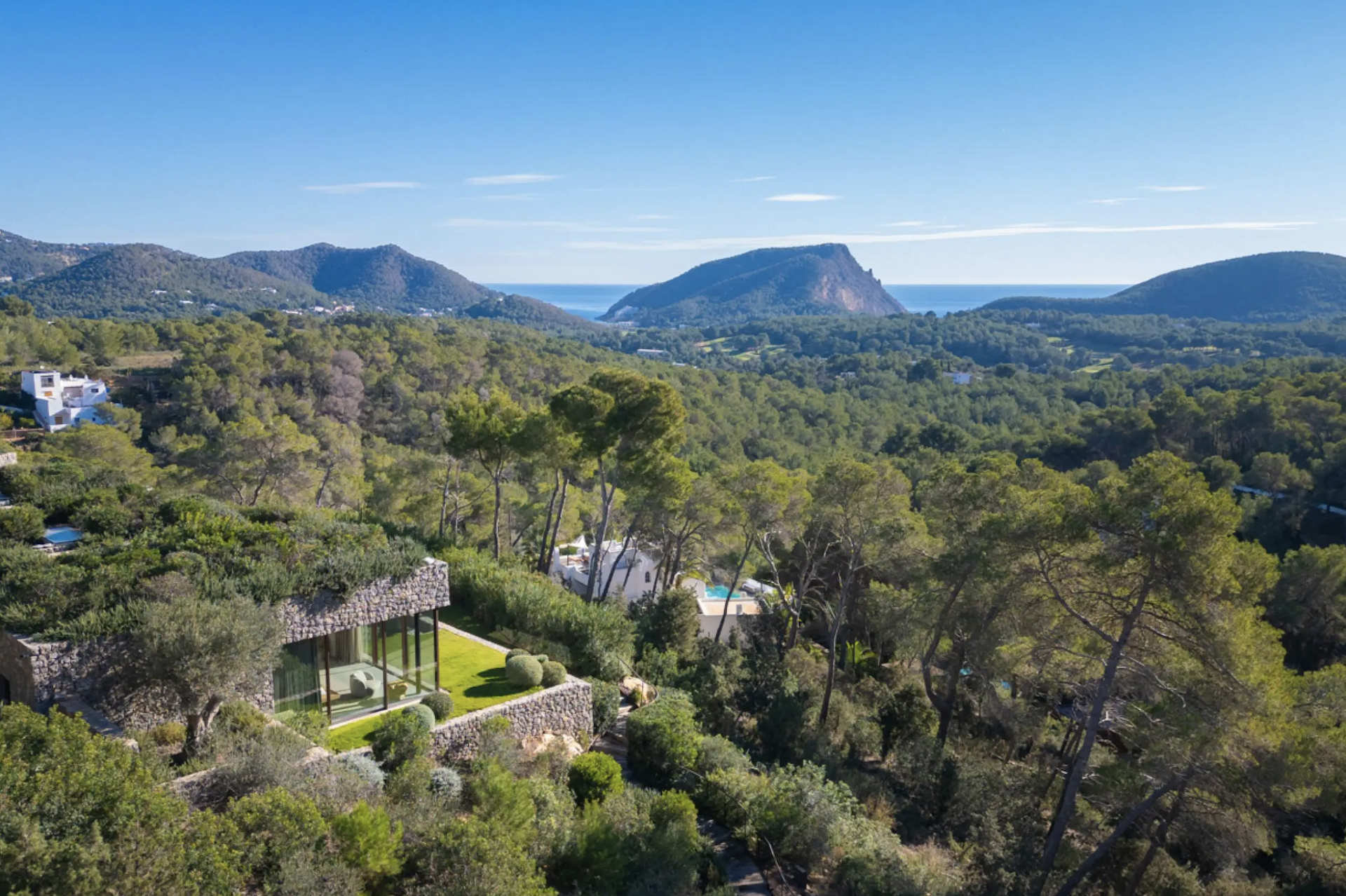 Can Bosc. Luxury villa integrated in nature with pool, green roofs and sea views