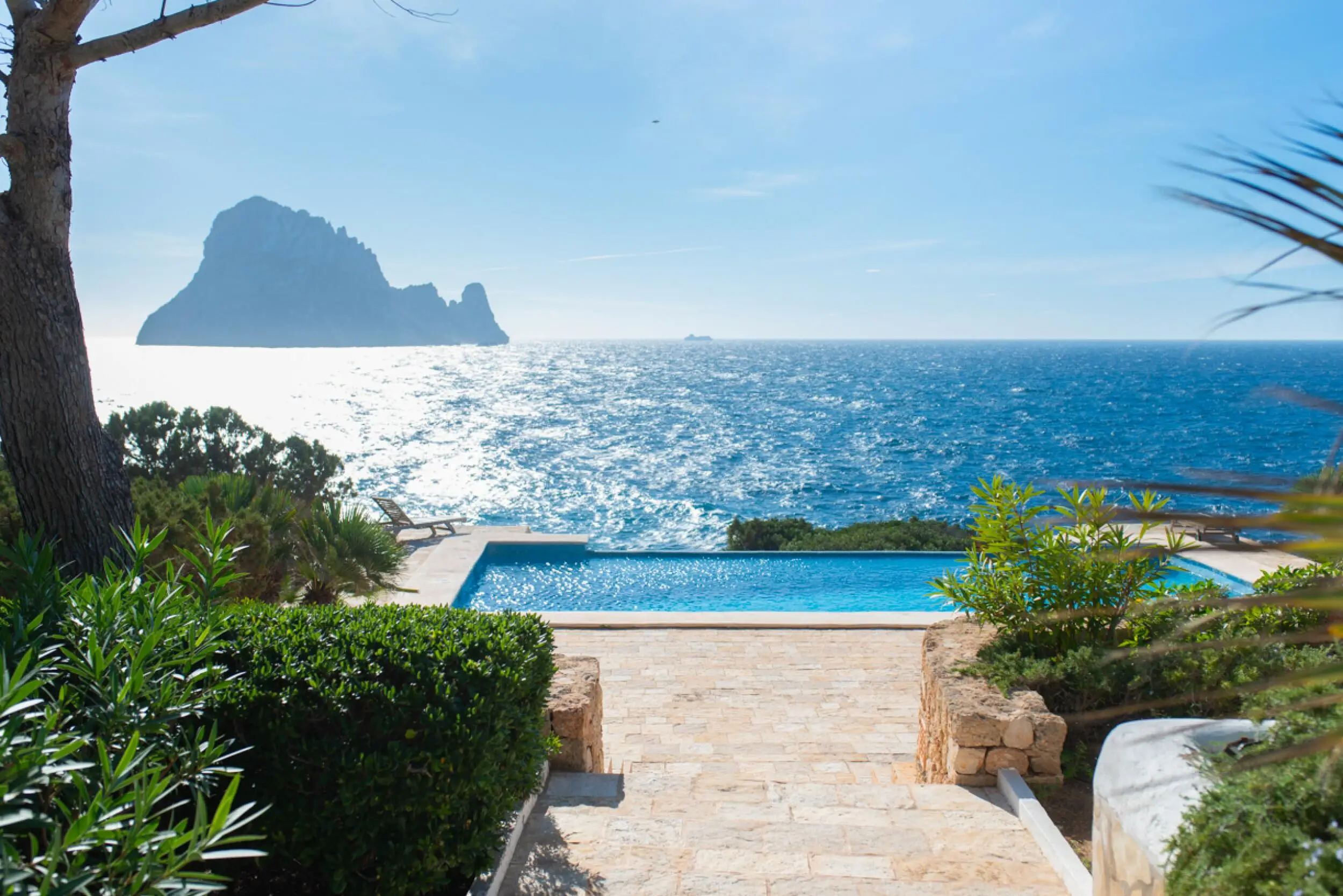 Can Vela is a frontline 7 bedroom, 7 bathroom villa in Cala Carbó, showcasing spectacular sea views and the iconic backdrop of Es Vedrà.